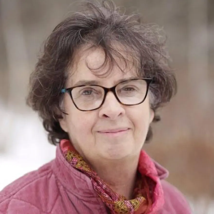 Headshot of fusion board member, Susan Mordecai. She is outdoors looking at the camera with a smile.