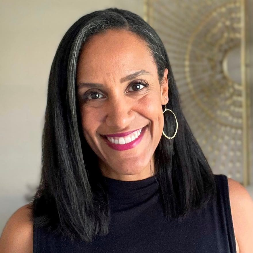 Headshot of fusion board member, Venessa Kayrell, looking at the camera smiling.